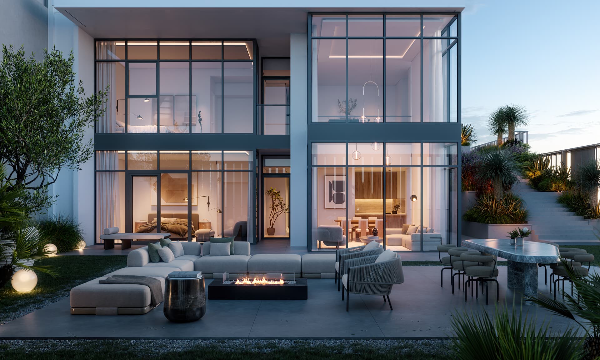 ARIA duplex living spaces opening onto a private terrace at dusk
